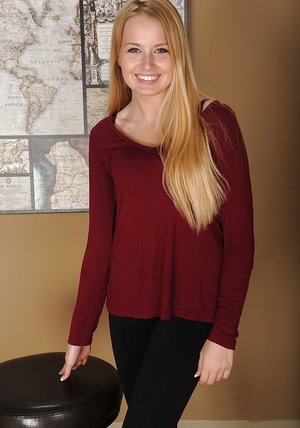 18 year old girl Katie Lewis stands naked after undressing in her bedroom